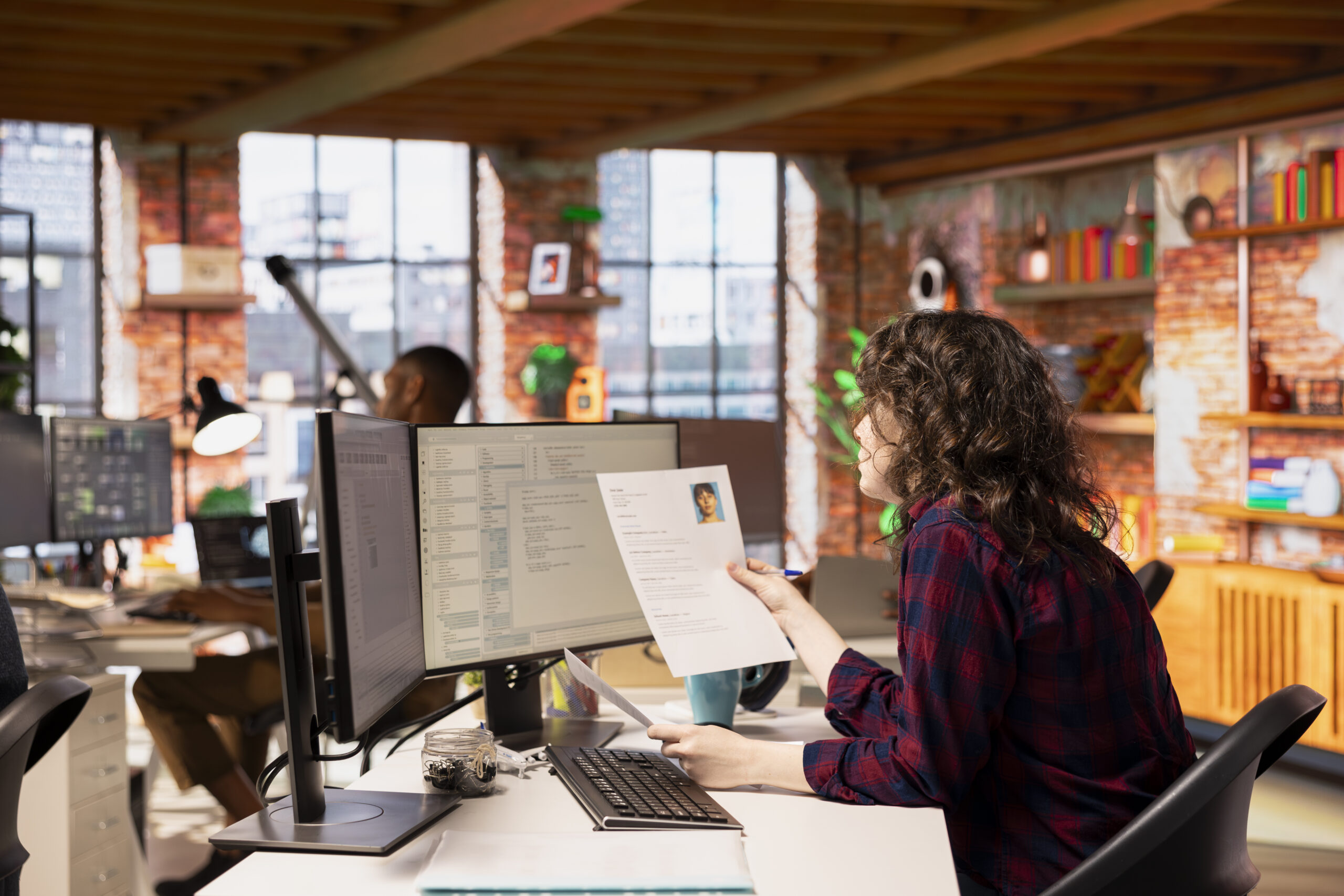 Home startup hr employer reading cvs for software development position
